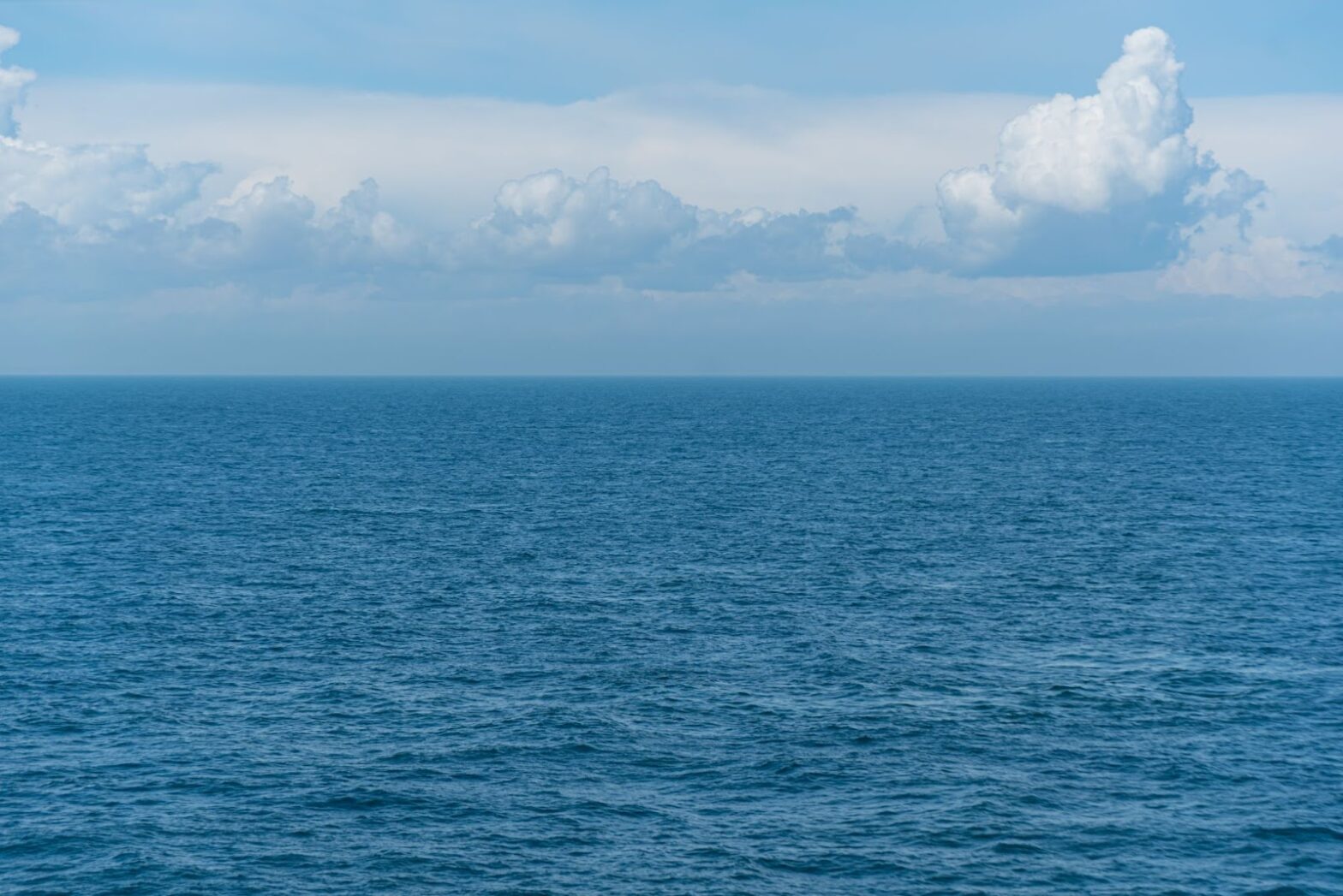 Ocean waves and cloudy sky
