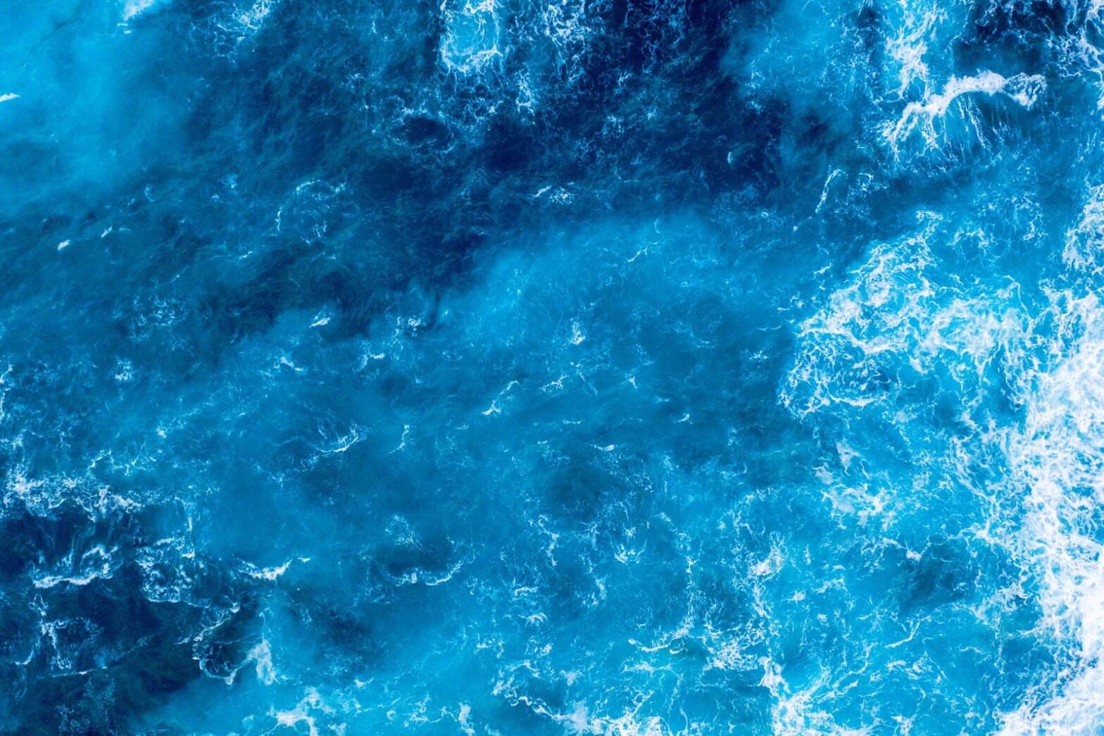 Top view of crystal blue ocean waves